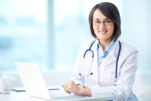 Female doctor at her computer | TELUS Health