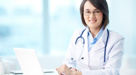 Female doctor at her computer | TELUS Health